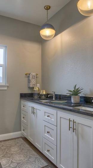 Redesign with granite in bathroom and white drawers with gray sink